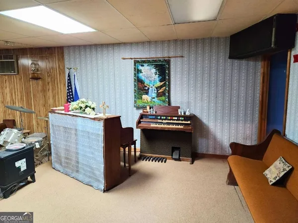 a room with furniture and gym equipment