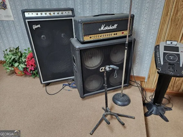 a bathroom with a sink a mirror and shower