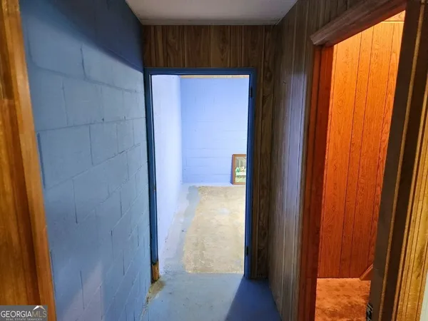 a view of a hallway with a window