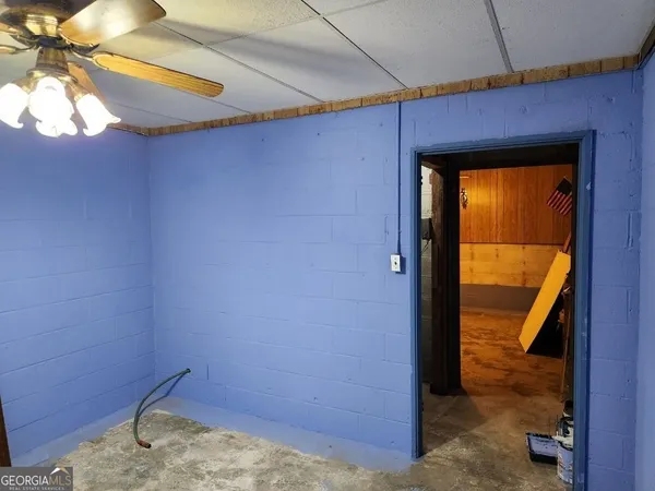 a view of walk in closet with clothes