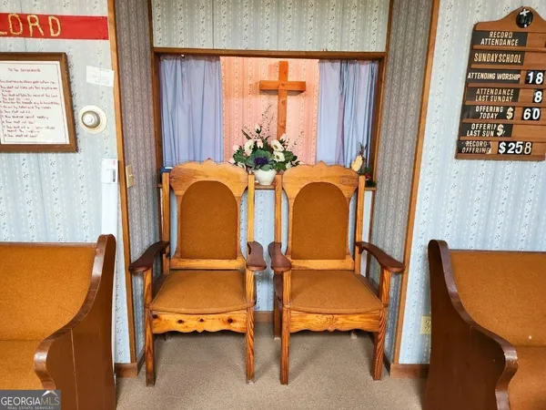 a balcony with table and chairs