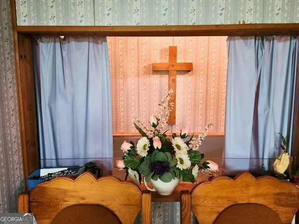 a bedroom with bed and a window