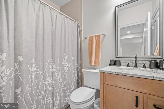 a sign that is sitting on a brick wall