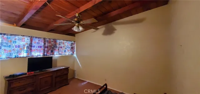 a room with wooden floor and furniture