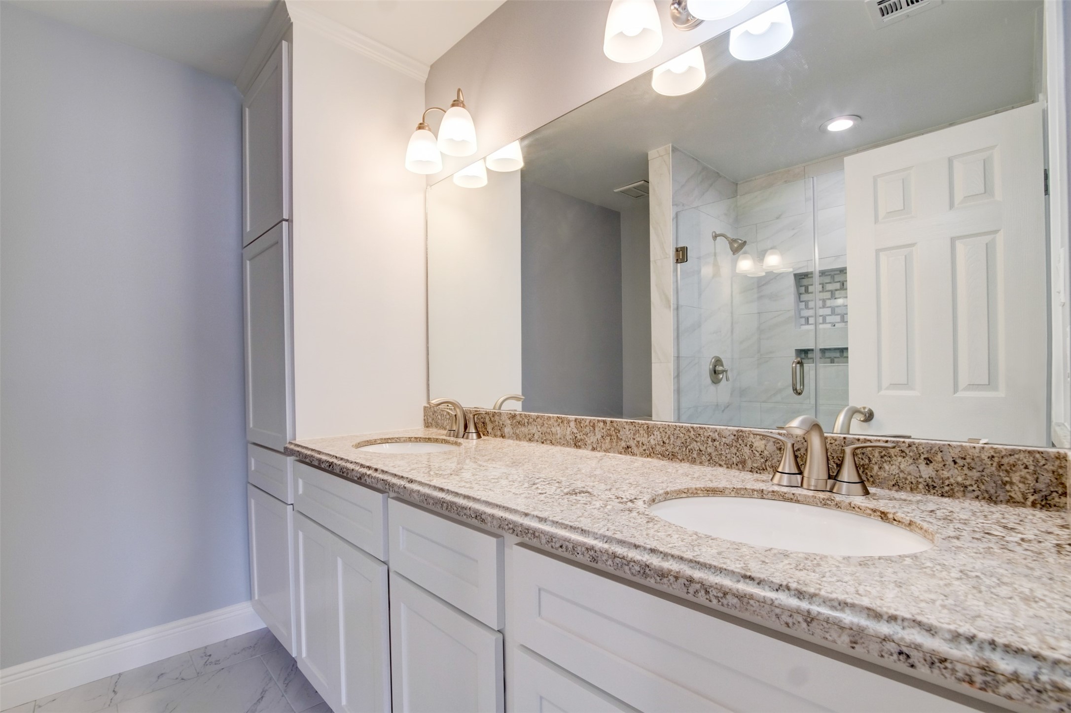 11840 Spring Grove Drive Houston, TX 77099 - Photo 18 of 27 Beautifully updated primary bath with double vanity and granite countertops
