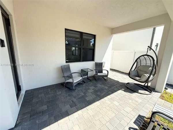 a living room with a couch and a window