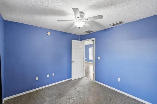 a view of a livingroom with a ceiling fan