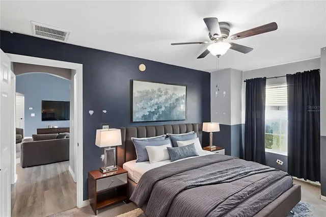 a bedroom with bed and window