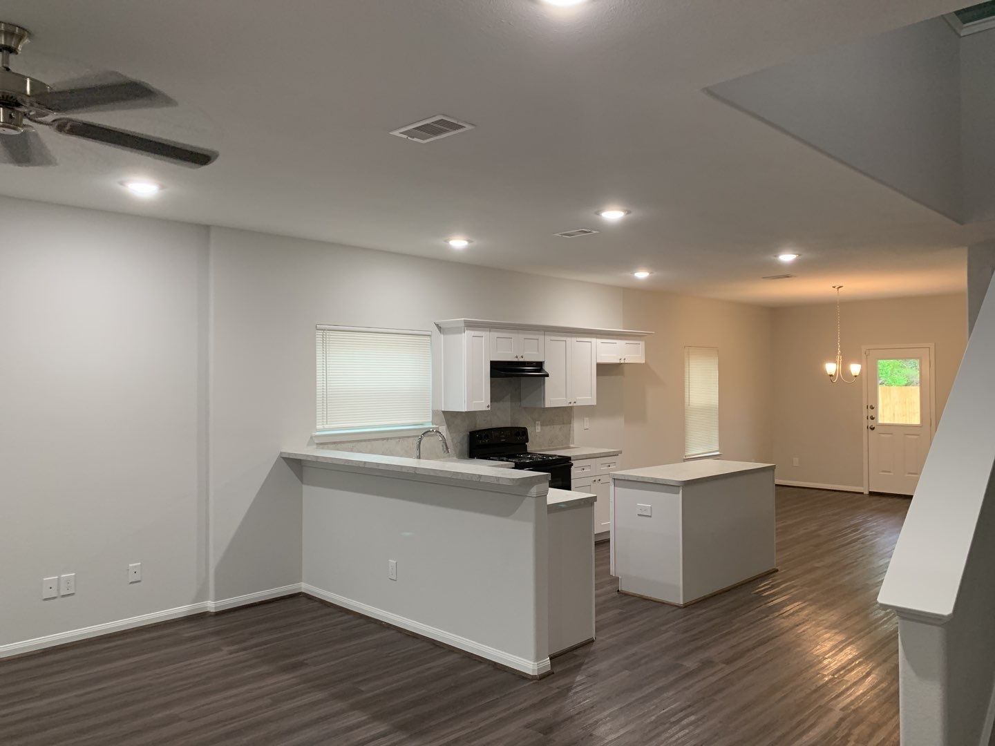 7966 Henson Street, Unit B Houston, TX 77028 - Photo 3 of 27 a kitchen with a sink stainless steel appliances and cabinets