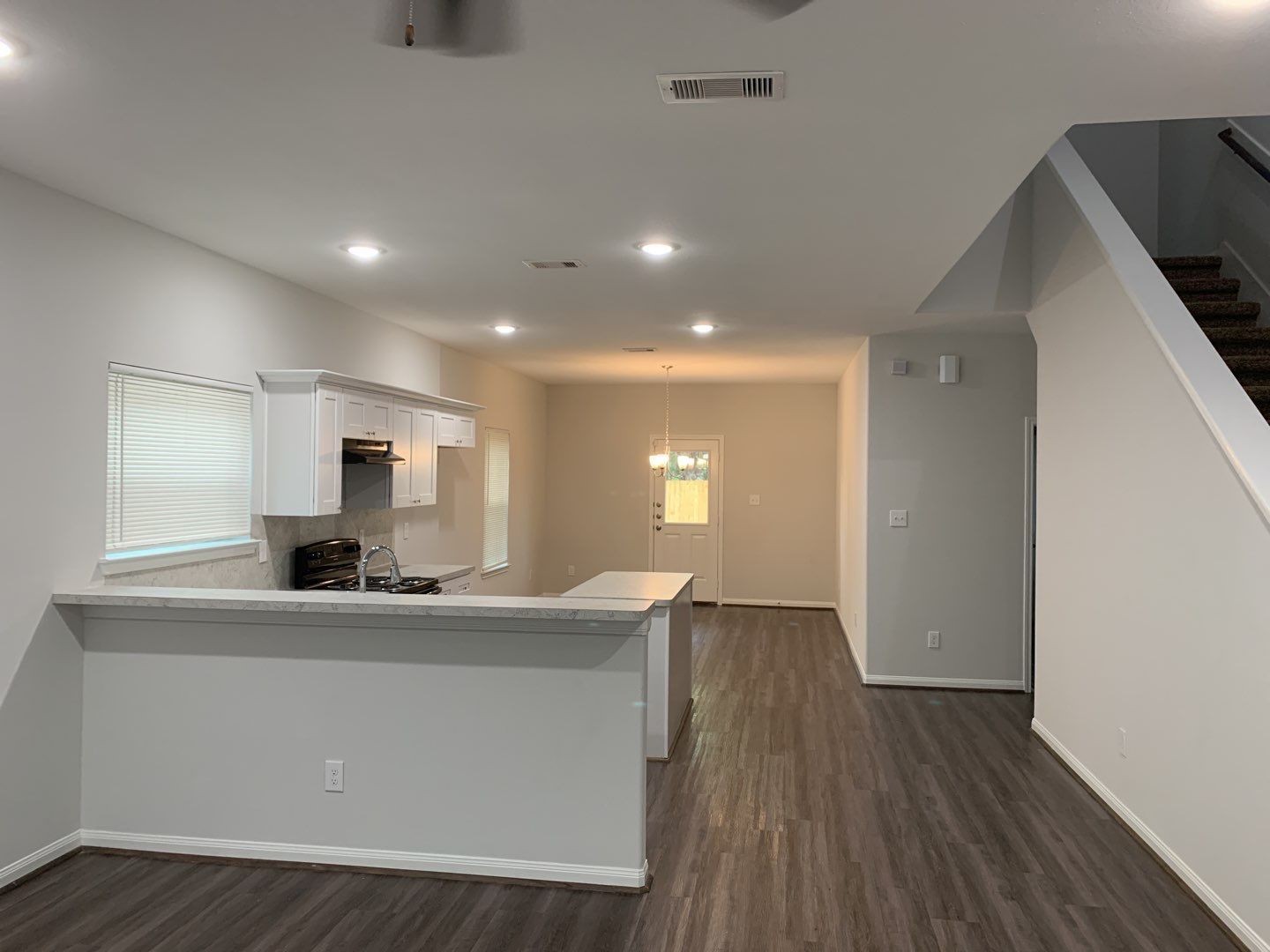 7966 Henson Street, Unit B Houston, TX 77028 - Photo 6 of 27 a kitchen with kitchen island a sink stainless steel appliances and cabinets