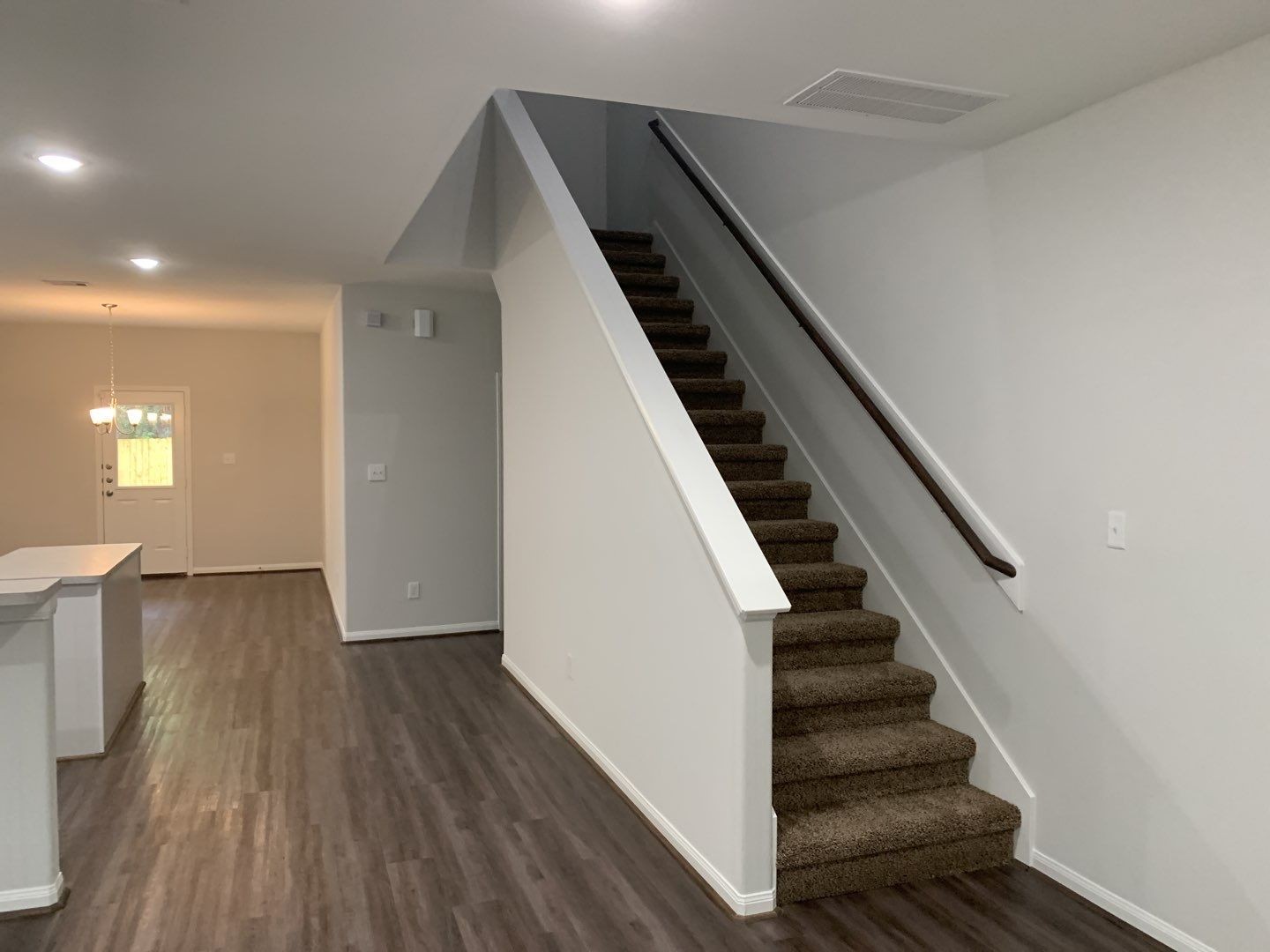 7966 Henson Street, Unit B Houston, TX 77028 - Photo 7 of 27 wooden floor in an empty room with wooden floor