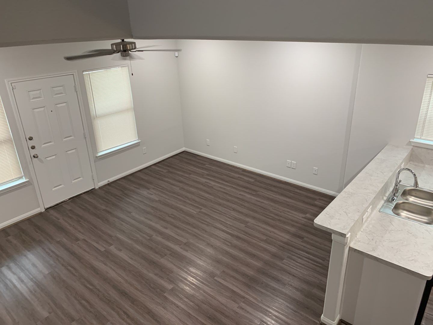 7966 Henson Street, Unit B Houston, TX 77028 - Photo 8 of 27 a view of an empty room with wooden floor and a window