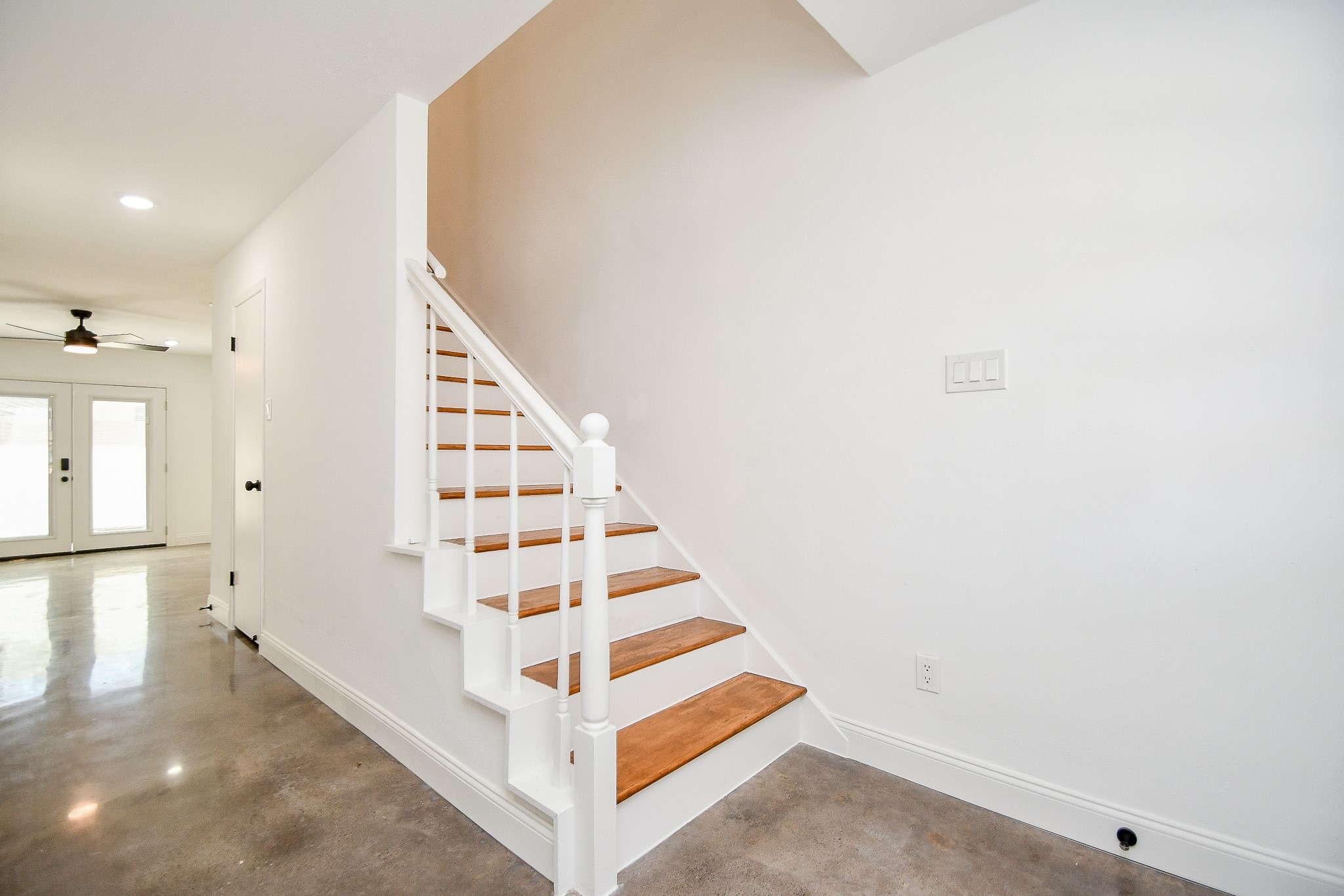 5801 Lumberdale Road, Unit 120 Houston, TX 77092 - Photo 11 of 45 a view of staircase with white walls and windows