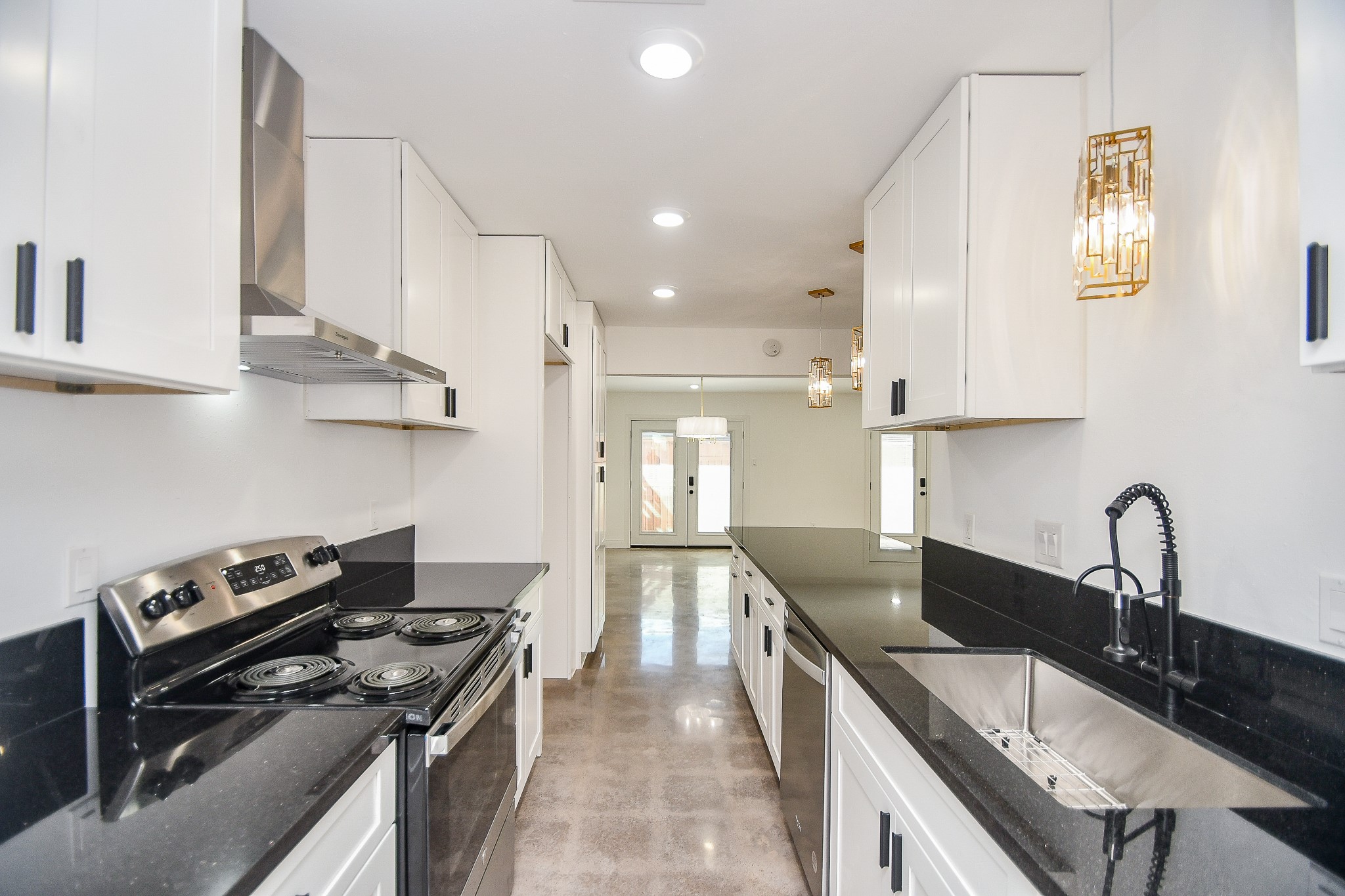 5801 Lumberdale Road, Unit 120 Houston, TX 77092 - Photo 12 of 45 a kitchen with granite countertop a sink stainless steel appliances and cabinets
