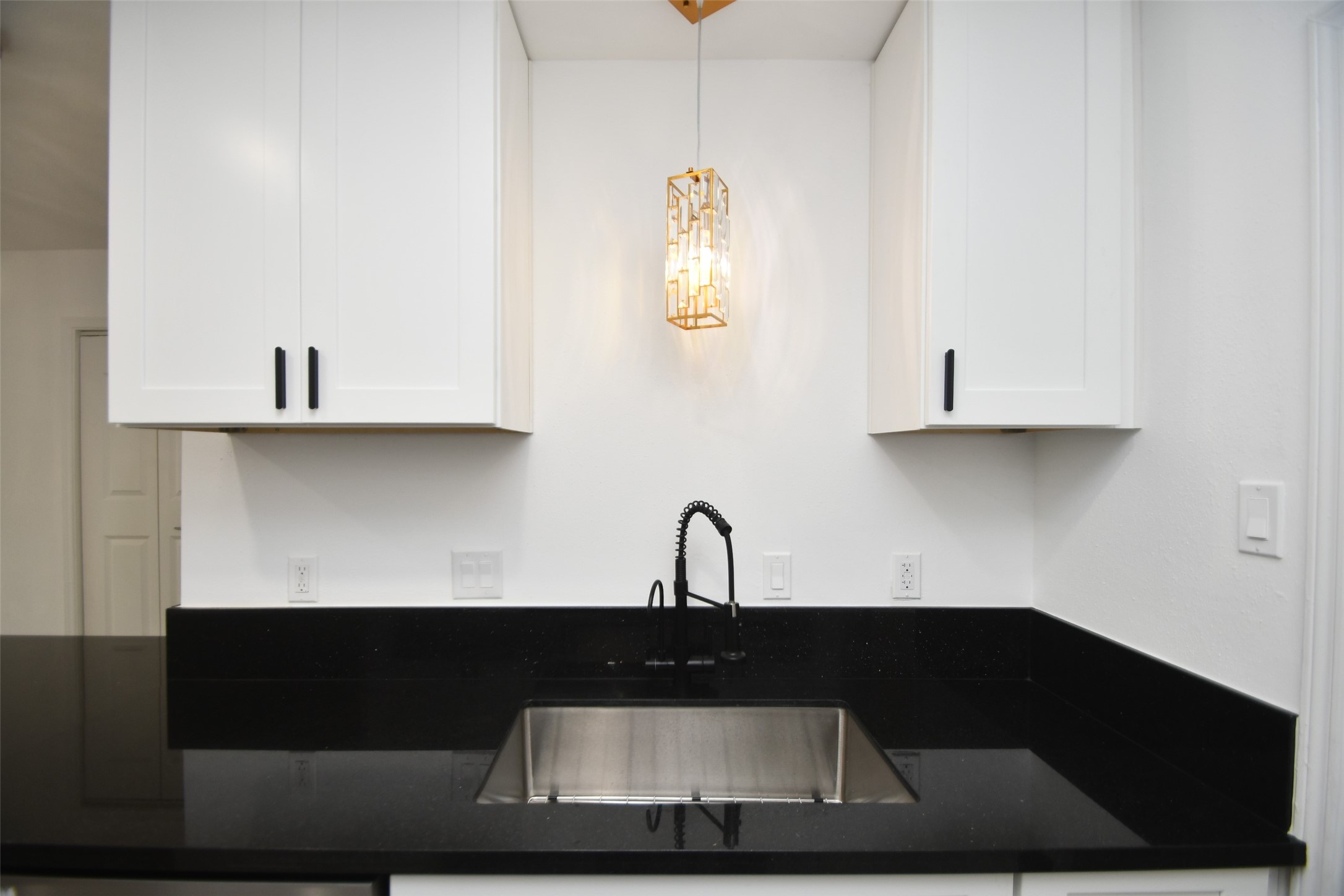 5801 Lumberdale Road, Unit 120 Houston, TX 77092 - Photo 13 of 45 a kitchen with a sink and cabinets