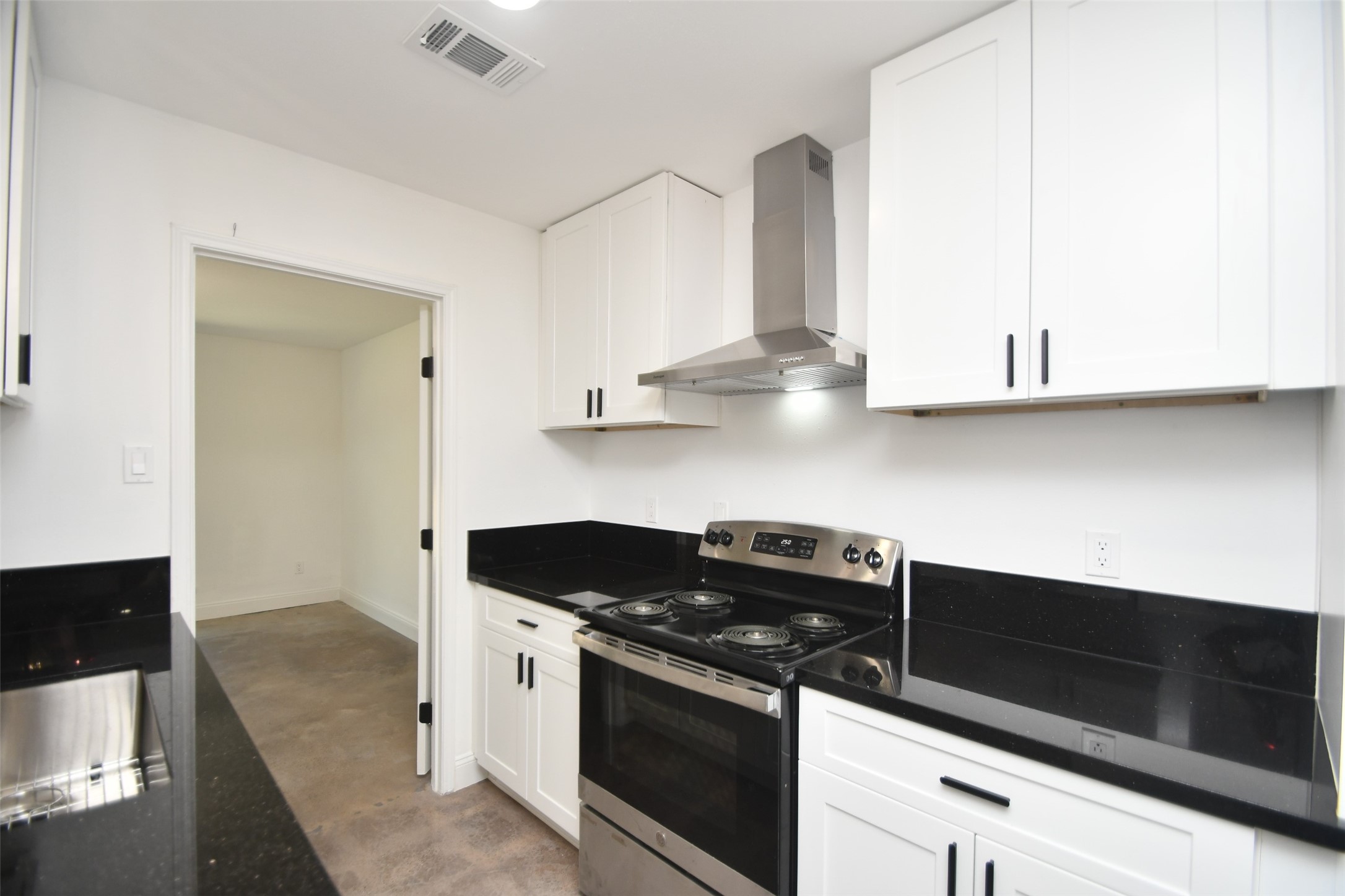 5801 Lumberdale Road, Unit 120 Houston, TX 77092 - Photo 15 of 45 a kitchen with stainless steel appliances granite countertop white cabinets and a stove