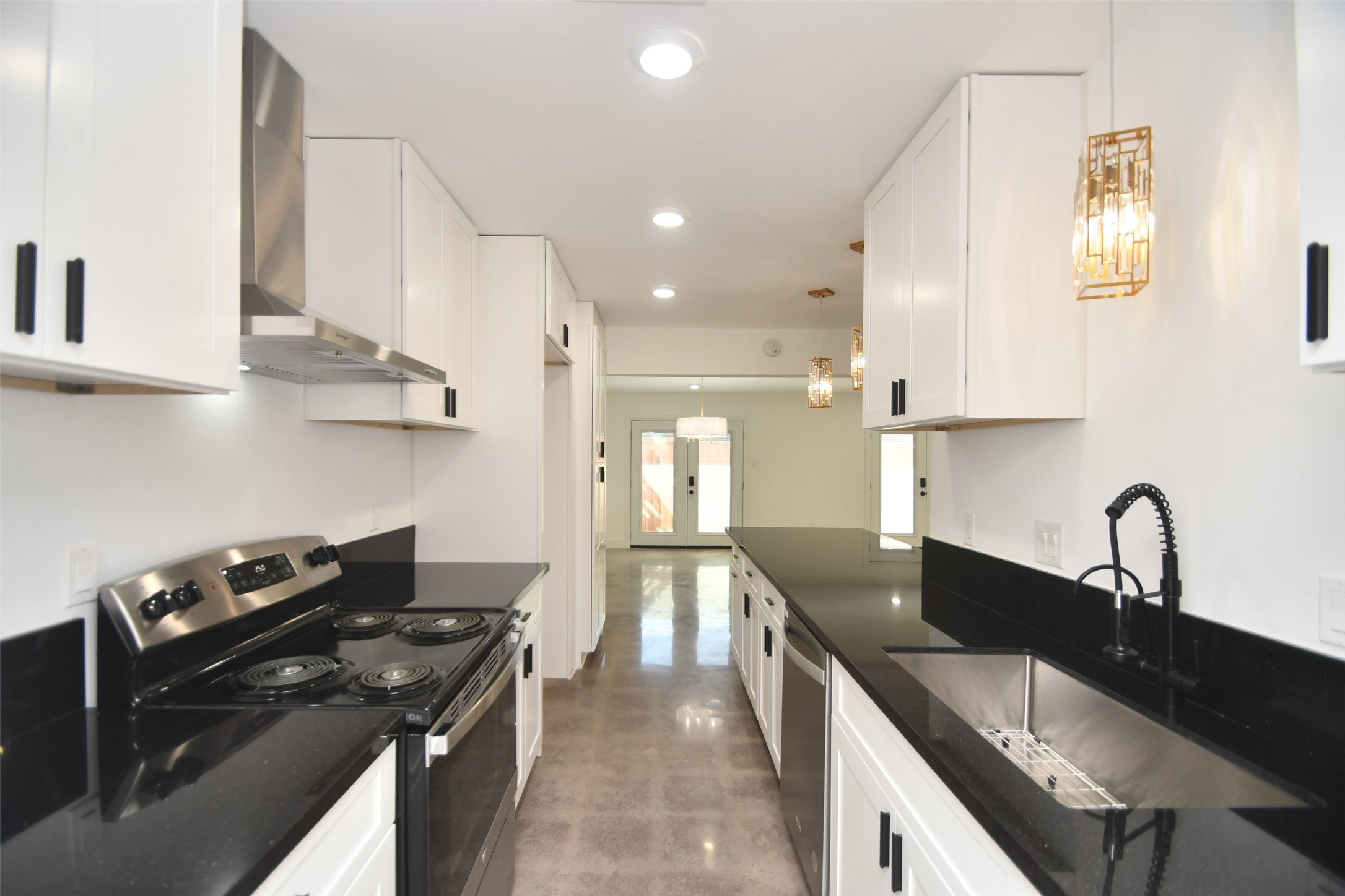 5801 Lumberdale Road, Unit 120 Houston, TX 77092 - Photo 16 of 45 a kitchen with granite countertop a sink stainless steel appliances and cabinets