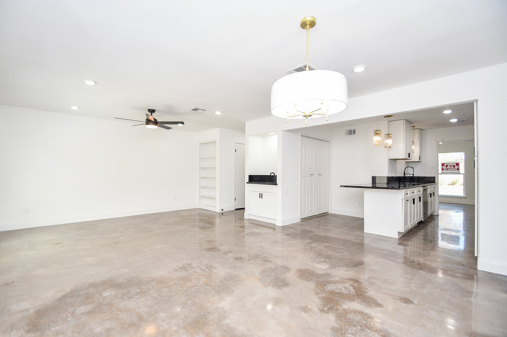 5801 Lumberdale Road, Unit 120 Houston, TX 77092 - Photo 19 of 45 an open kitchen with a refrigerator and white cabinets