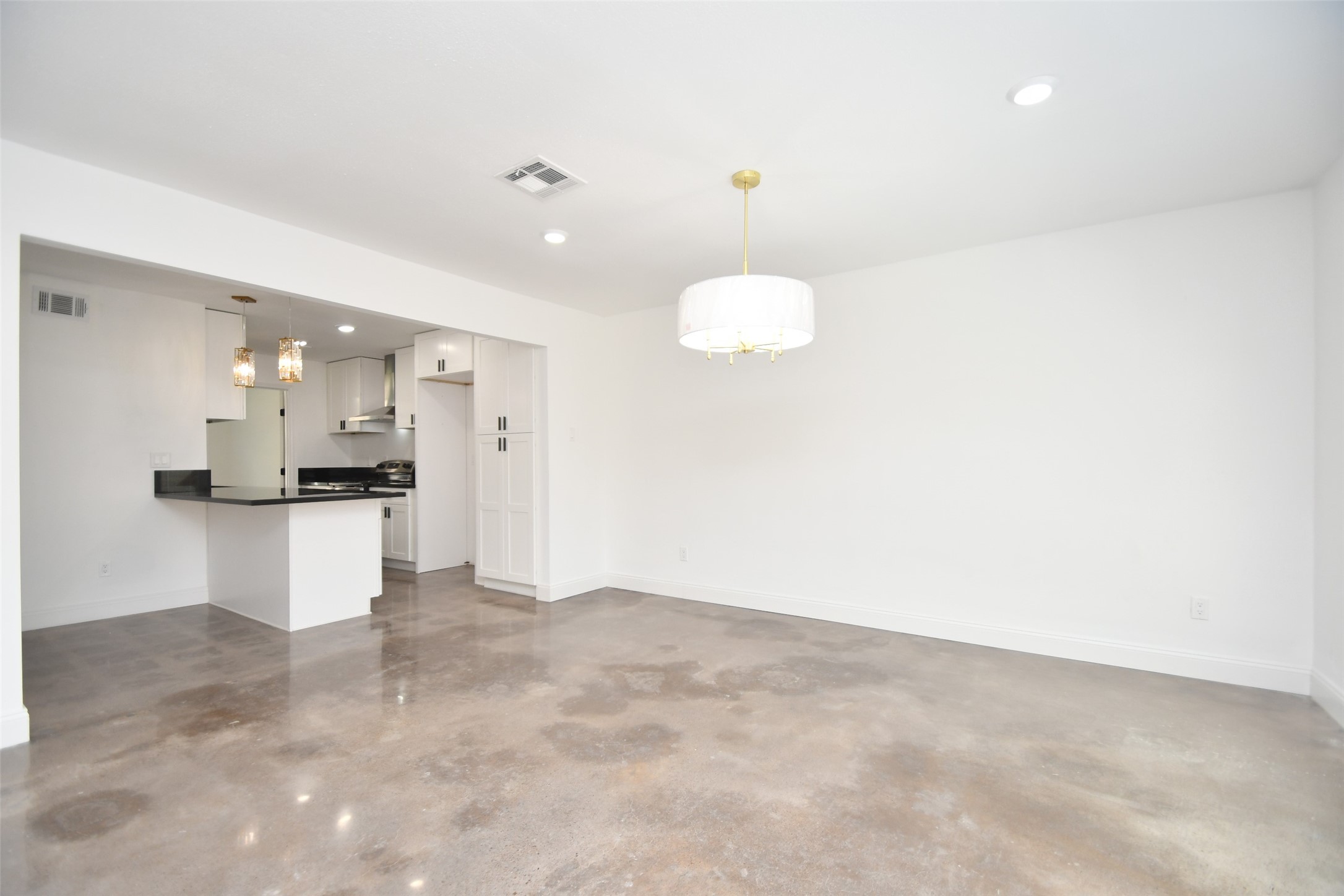 5801 Lumberdale Road, Unit 120 Houston, TX 77092 - Photo 21 of 45 a view of kitchen with refrigerator and white cabinets