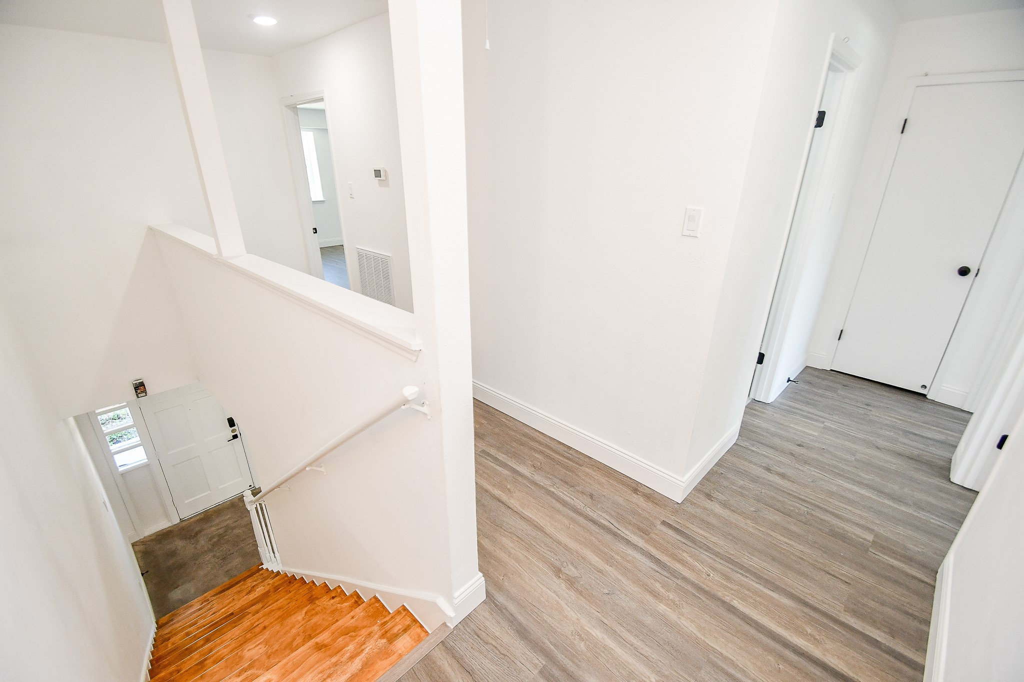 5801 Lumberdale Road, Unit 120 Houston, TX 77092 - Photo 26 of 45 a view of hallway with stairs and wooden floor