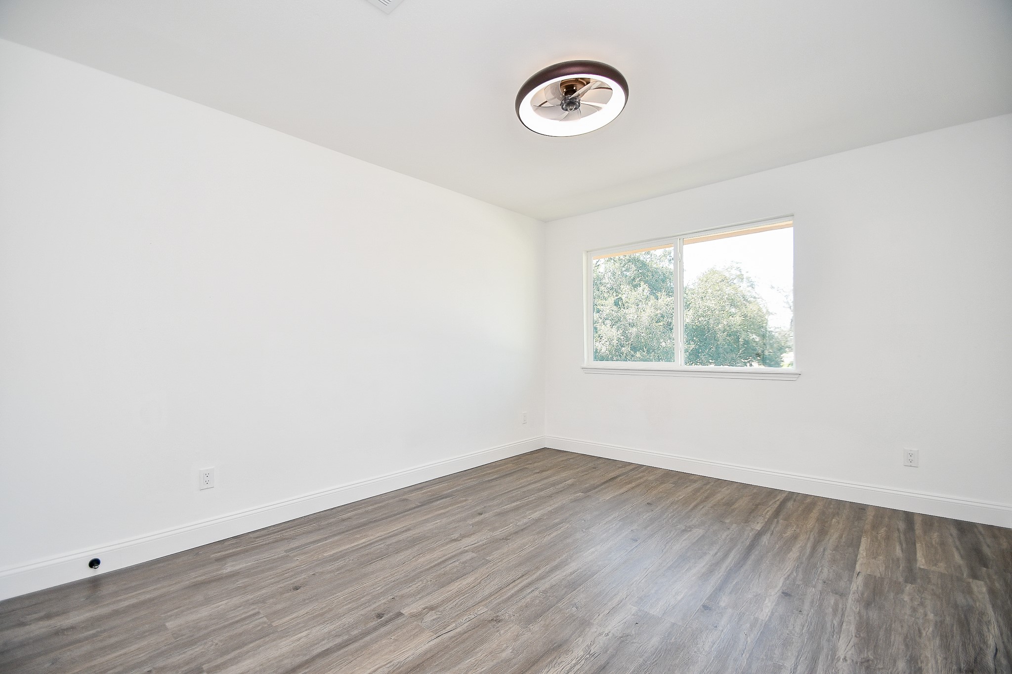 5801 Lumberdale Road, Unit 120 Houston, TX 77092 - Photo 38 of 45 a view of a room with wooden floor and window