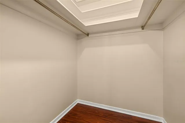 a view of a swimming pool with a patio and a yard