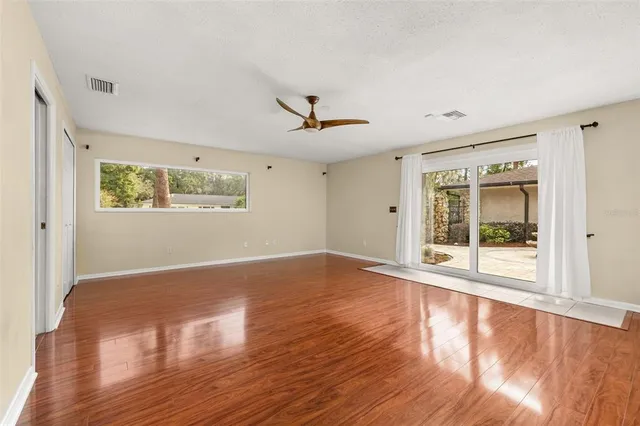 an aerial view of residential houses with outdoor space and swimming pool