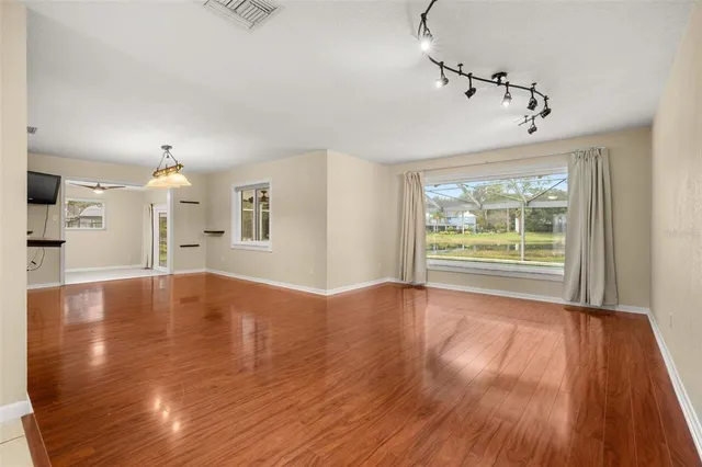 a kitchen with stainless steel appliances granite countertop a refrigerator and a stove
