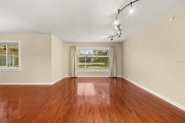 a living room with fireplace furniture and a flat screen tv