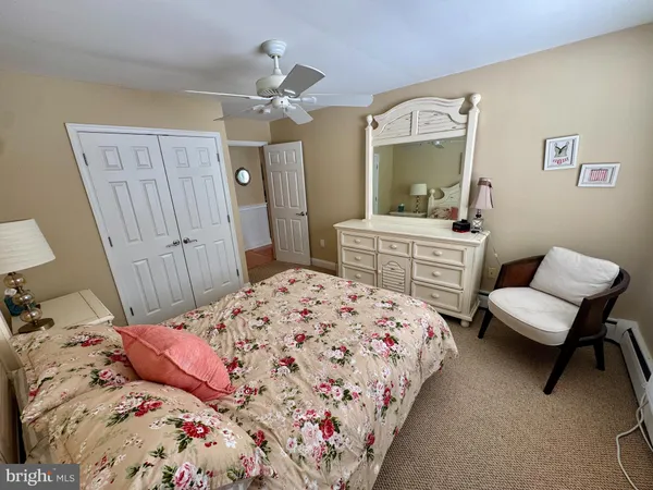 a bedroom with a bed and a dresser