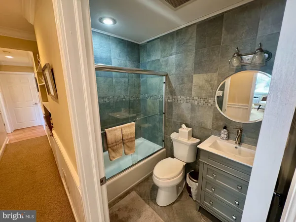 a bathroom with a toilet sink and shower