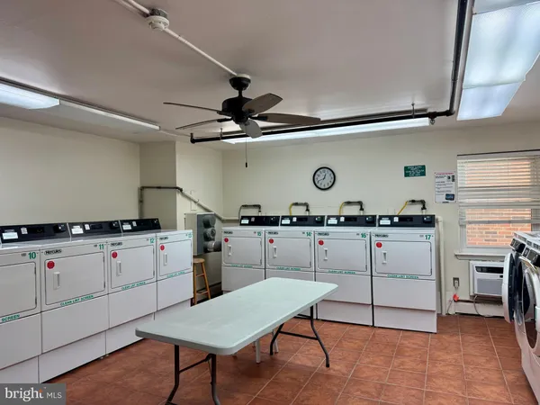 a kitchen with a table and chairs