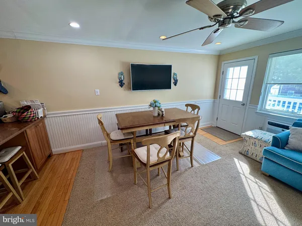 a view of a livingroom with furniture and a flat screen tv