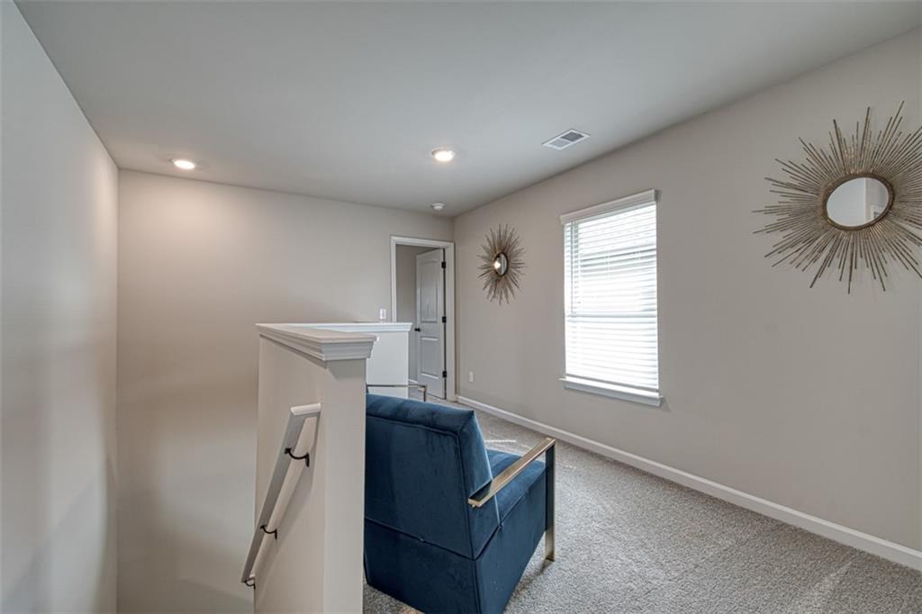 11951 Brightside Parkway Hampton, GA 30228 - Photo 13 of 25 a living room with furniture and a window