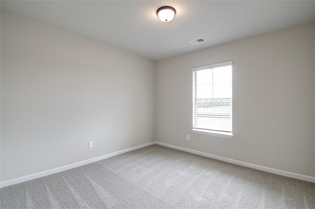 11951 Brightside Parkway Hampton, GA 30228 - Photo 14 of 25 an empty room with a window