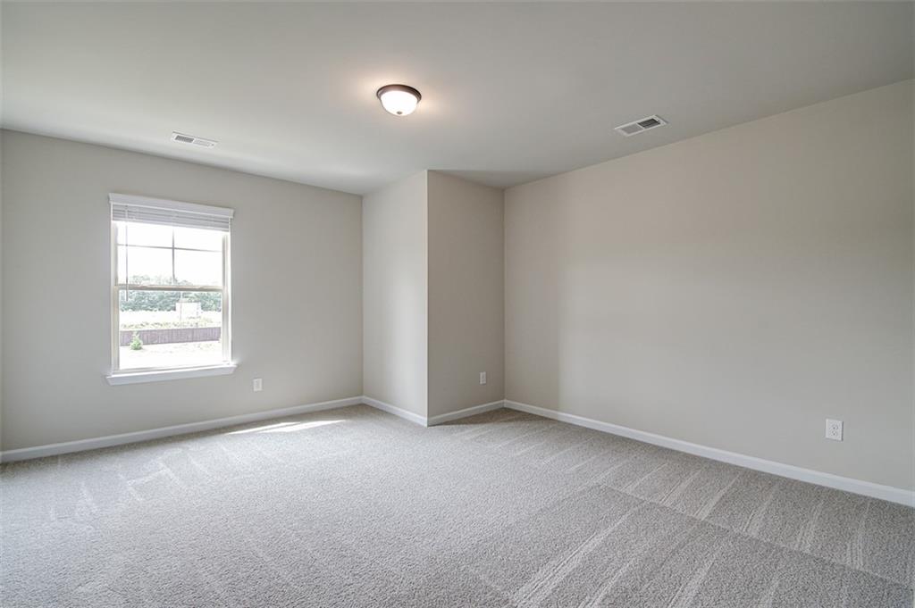 11951 Brightside Parkway Hampton, GA 30228 - Photo 15 of 25 an empty room with a window