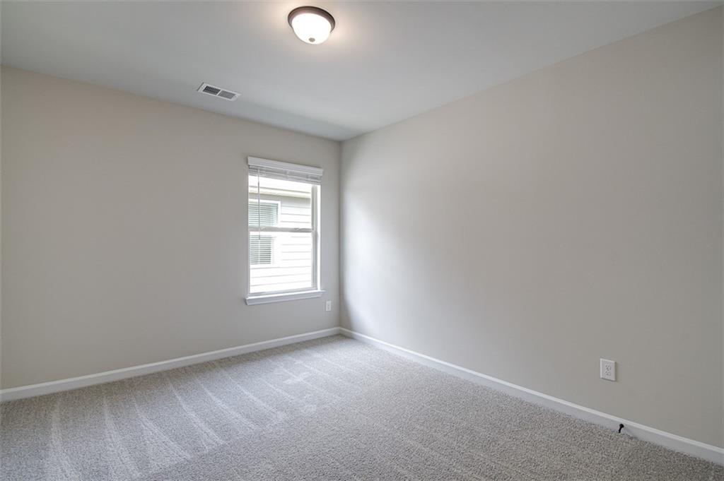 11951 Brightside Parkway Hampton, GA 30228 - Photo 16 of 25 an empty room with a window