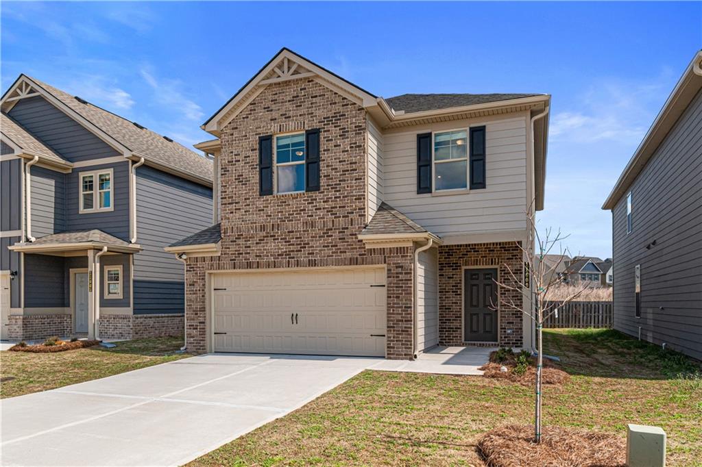 11951 Brightside Parkway Hampton, GA 30228 - Photo 3 of 25 a front view of a house with garden