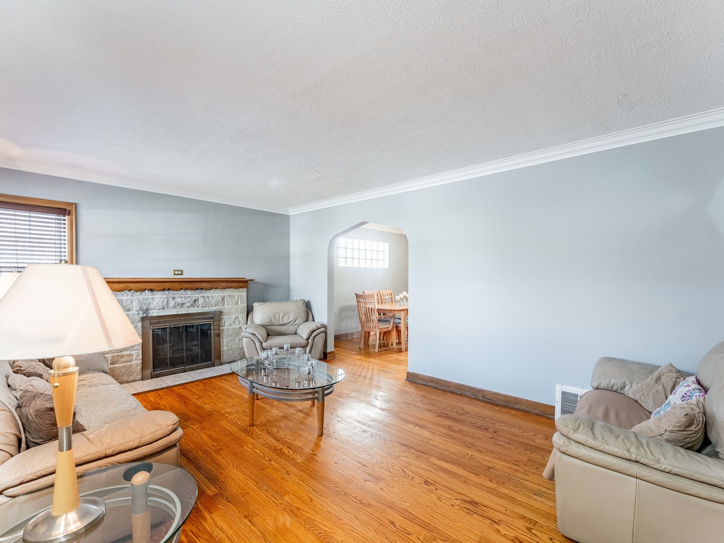 3519 Ridgeland Avenue Berwyn, IL 60402 - Photo 3 of 29 a living room with furniture and a fireplace