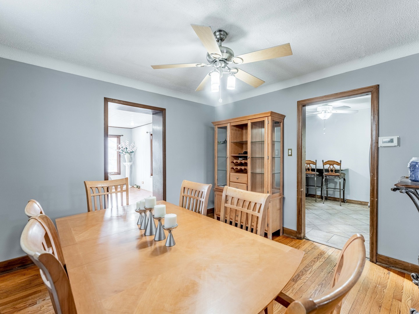 3519 Ridgeland Avenue Berwyn, IL 60402 - Photo 4 of 29 a dining room with wooden floor and chandelier