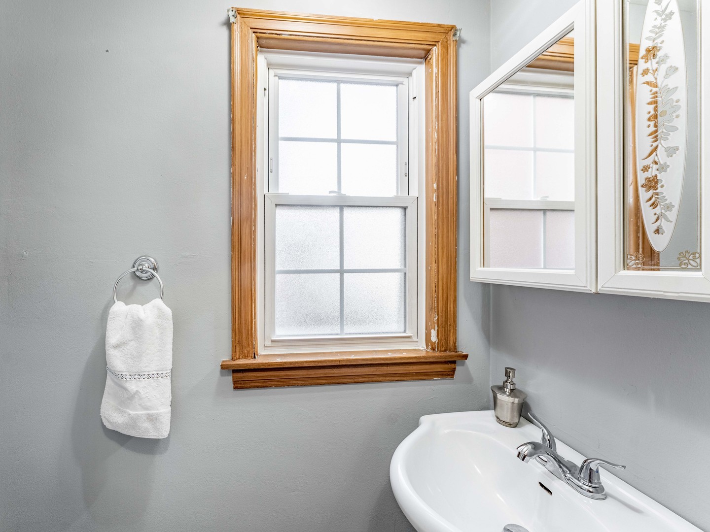 3519 Ridgeland Avenue Berwyn, IL 60402 - Photo 6 of 29 a bathroom with a sink and a window