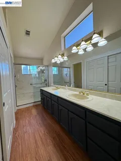 a bathroom with a shower and a bath tub