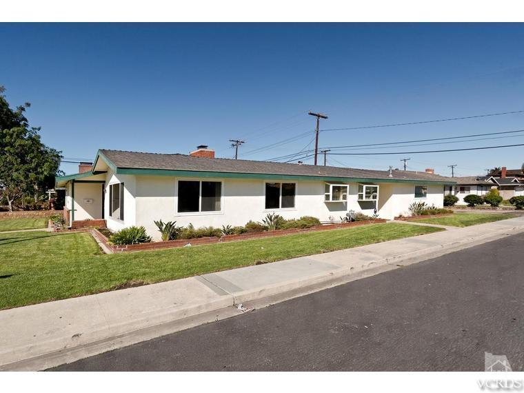 805 West Roderick Avenue Oxnard, CA 93030 - Photo 2 of 24 a front view of a house with a yard and garage