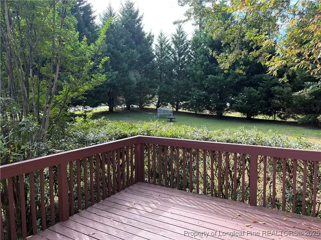 a wooden bench sitting in the middle of a park