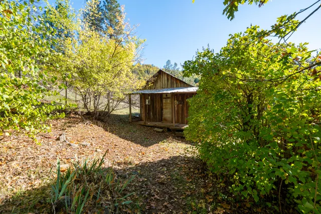 a kitchen with sink a window and cabinets