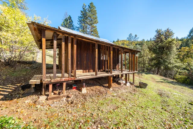 a white refrigerator freezer sitting in a kitchen with stainless steel appliances granite countertop wooden cabinets and a refrigerator