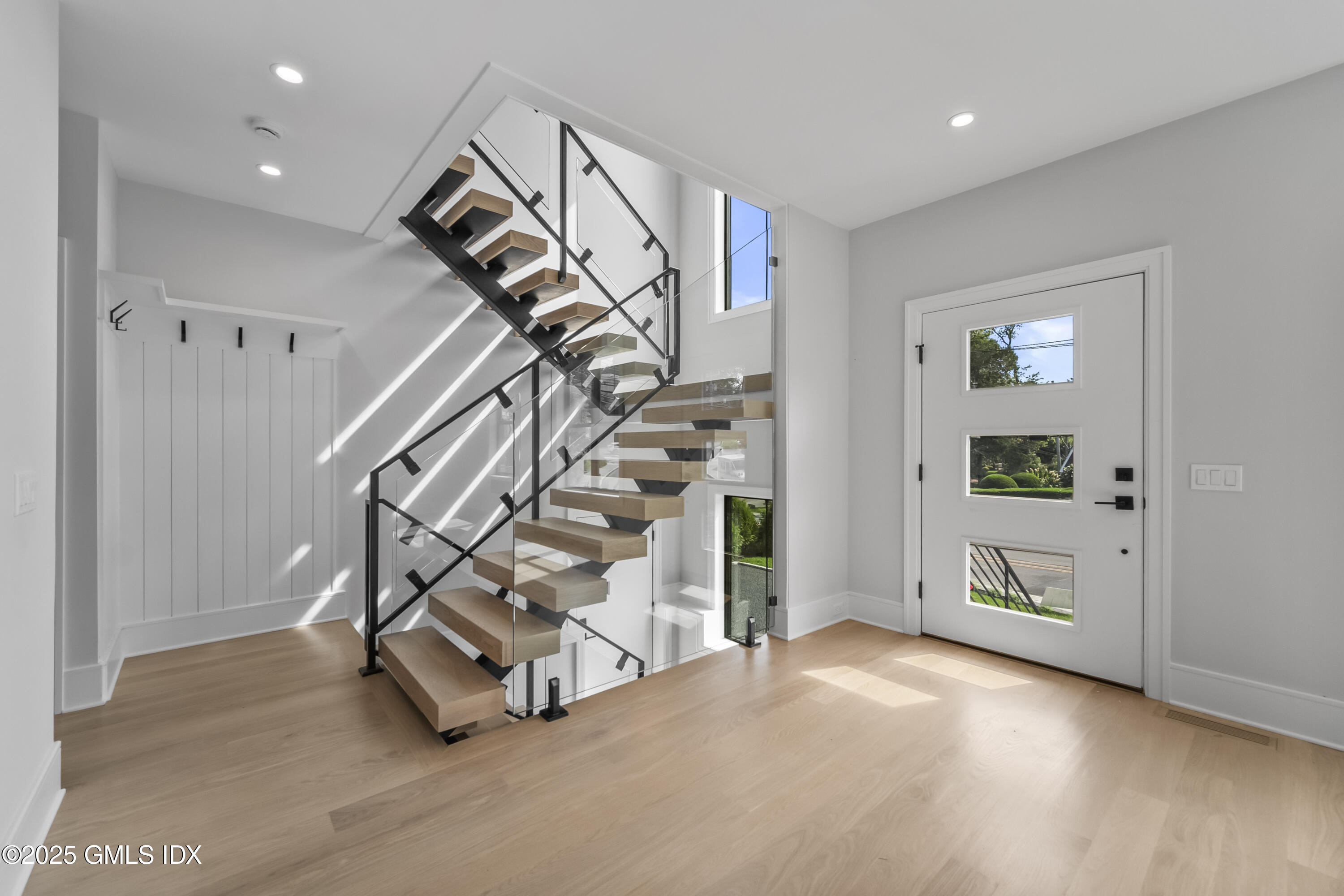 71 Old Field Point Road Greenwich, CT 06830 - Photo 11 of 33 a view of entryway and hall with wooden floor