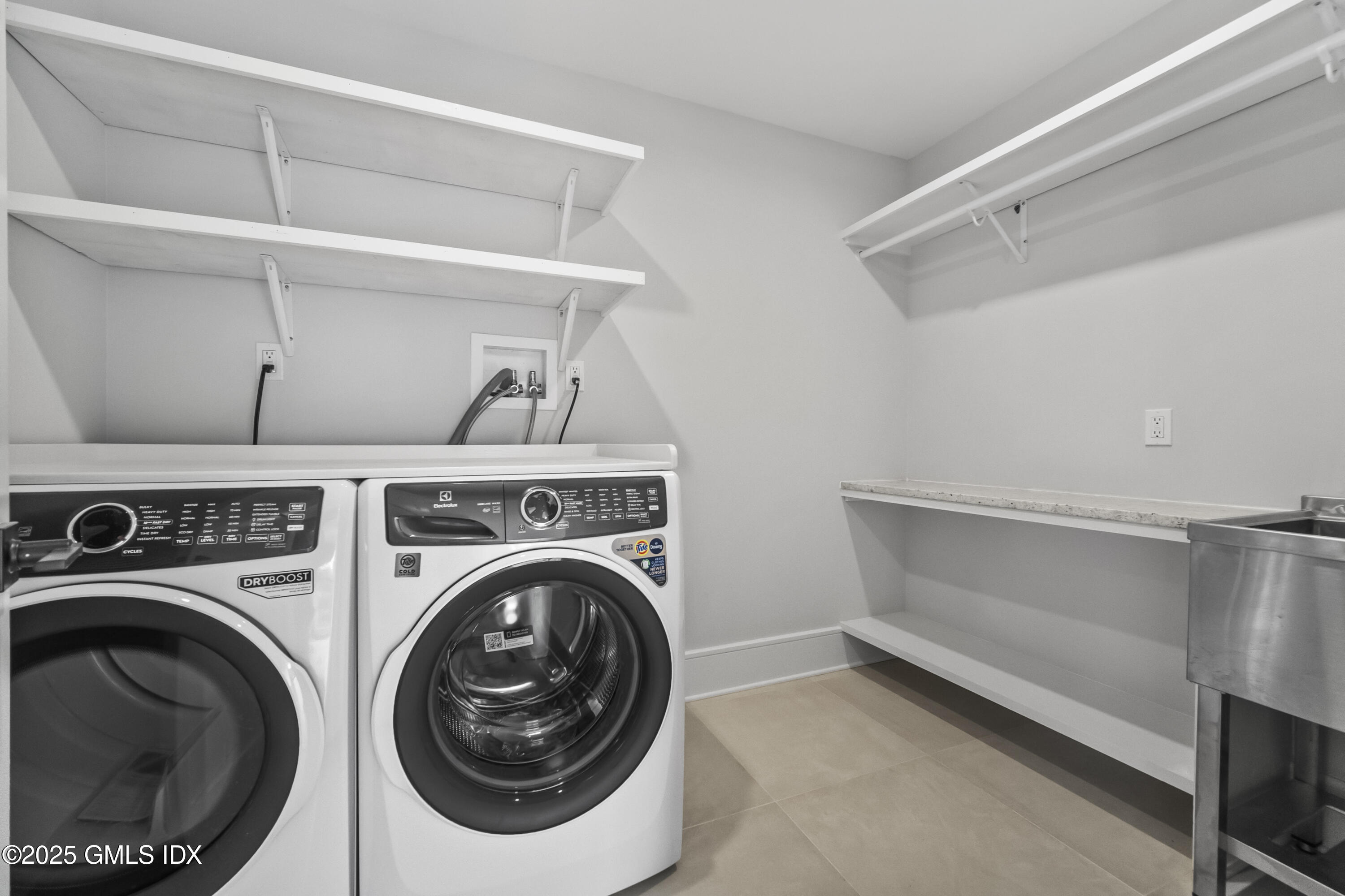 71 Old Field Point Road Greenwich, CT 06830 - Photo 13 of 33 a utility room with dryer and washer