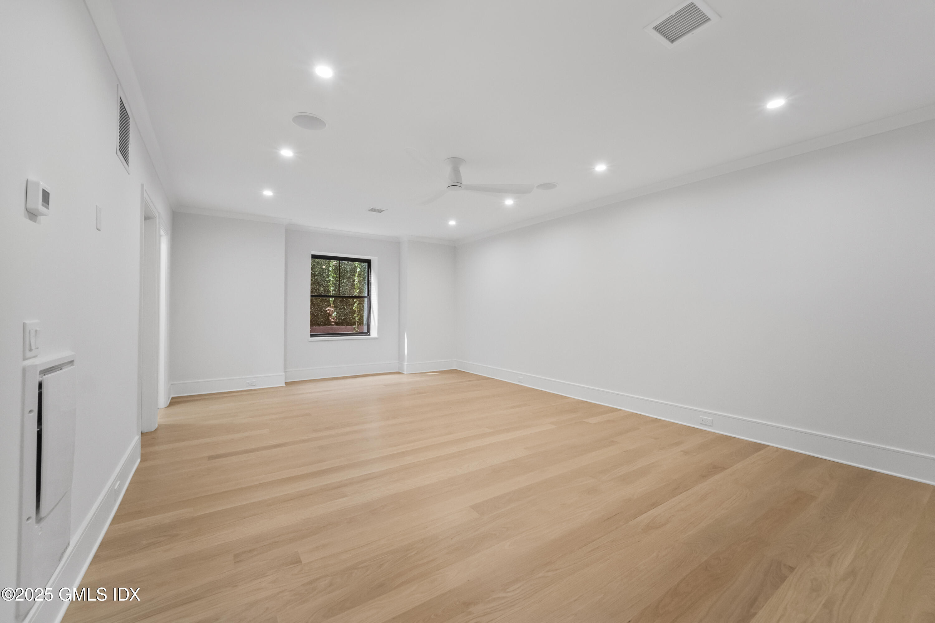 71 Old Field Point Road Greenwich, CT 06830 - Photo 25 of 33 a view of an empty room with a window