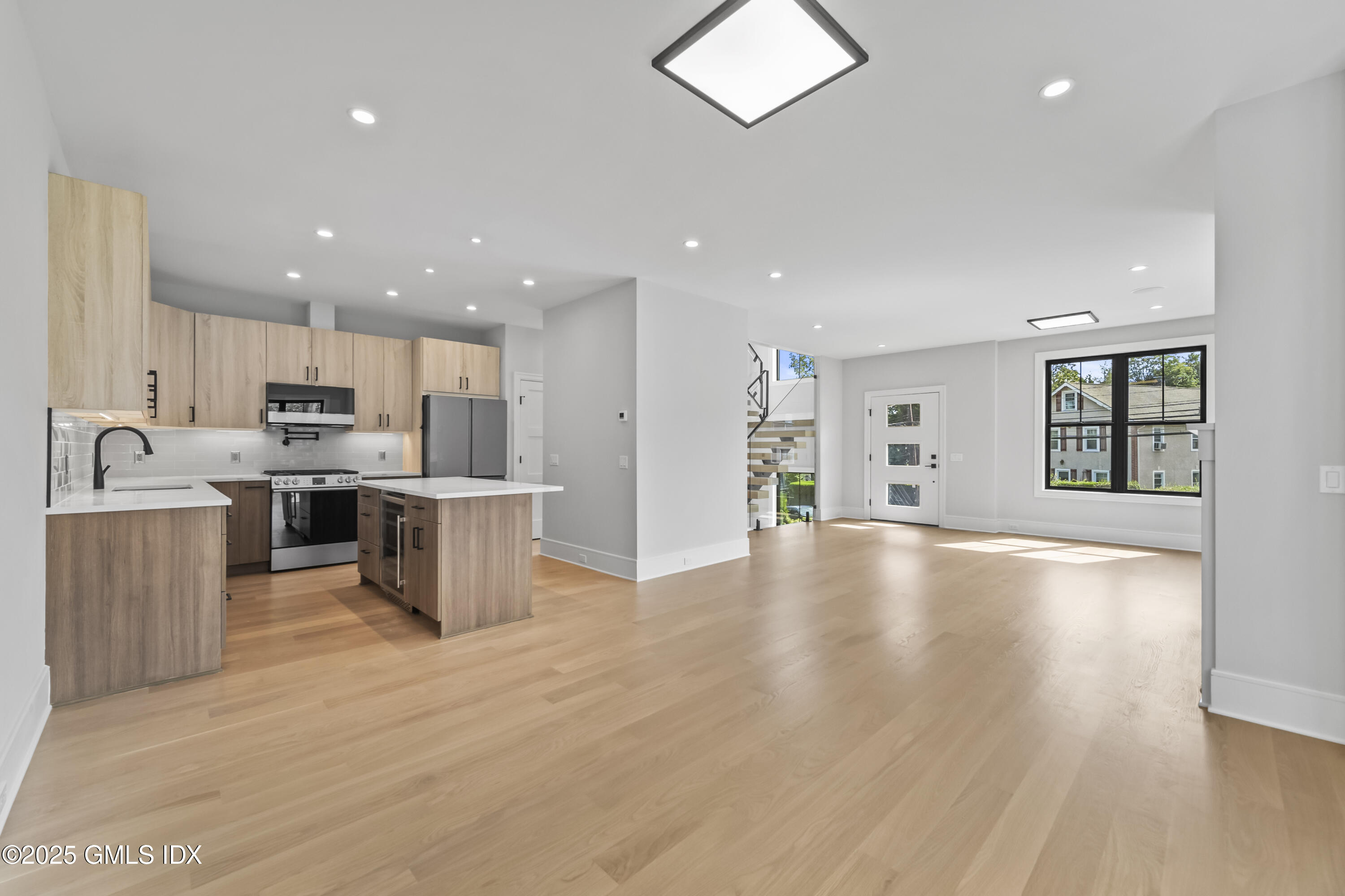 71 Old Field Point Road Greenwich, CT 06830 - Photo 6 of 33 a view of kitchen with cabinets and wooden floor